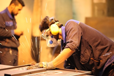 person in blue t-shirt wearing blue mask